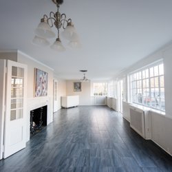 Woman's Club of Bethesda - The long narrow sunroom is light filled and perfect for cocktails, buffet, or an intimate ceremony.