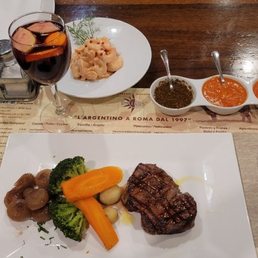Filet and vegetables, sangria, shrimp cocktail, and the trio of sauces. Filet and vegetables, sangria, shrimp cocktail, and the trio of sauces.