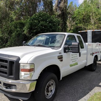 Start To Finish Lawn Care - a white utility truck - Landscaping Near Me - Archer, Florida Start To Finish Lawn Care - a white utility truck - Landscaping Near Me - Archer, Florida