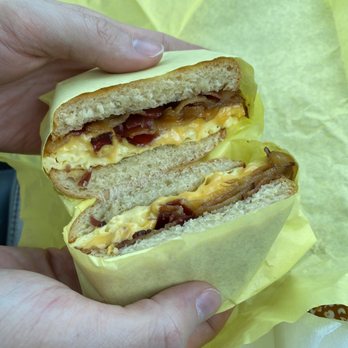 Nom Donuts - Biscuit sandwich with bacon & egg - Donuts Near Me - Houston, Texas