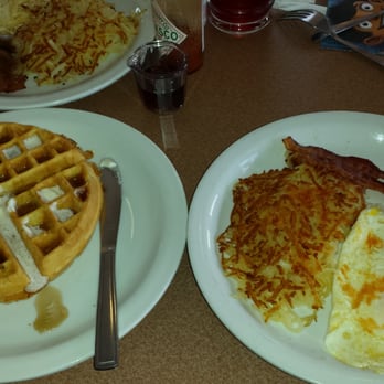 Denny's - Belgian waffle, hash, over medium eggs , and bacon and a glass of cranberrie juice... - American Near Me - Atwater, California Denny's - Belgian waffle, hash, over medium eggs , and bacon and a glass of cranberrie juice... - American Near Me - Atwater, California