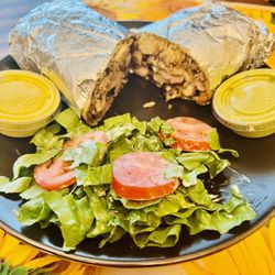 Chick Houz - Brasa Burrito with salad and green and yellow sauce