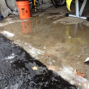 Pave Tech - Water damage caused by incoorect pitch of the driveway PaveTech built last fall Oct 2013 - Masonry/Concrete Near Me