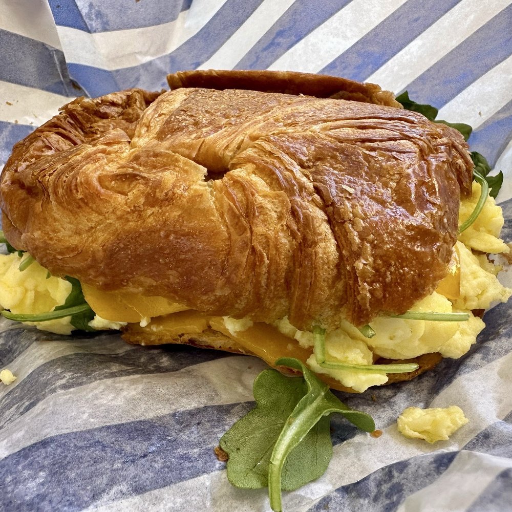 Bluestone Lane - Eggs Breakfast croissant! Looks can be deceiving this was delish!!! - Coffee & Tea Near Me - Long Beach, California Bluestone Lane - Eggs Breakfast croissant! Looks can be deceiving this was delish!!! - Coffee & Tea Near Me - Long Beach, California
