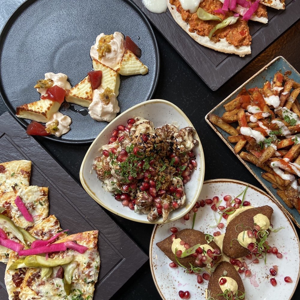 Fairouz - vegetarian kibbeh, seared halloumi, chicken and artichoke manakeesh, olive and cheese manakeesh, Phoenician fries, fried cauliflower - Middle Eastern Near Me - Ottawa, Ontario
