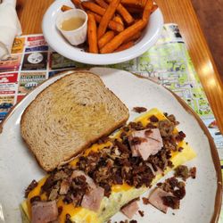 Baker's Kitchen - Meatlovers Omelet with a side of sweet potato fries