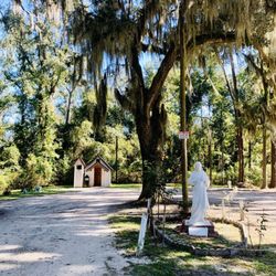 Christ’s Chapel in Memory Park - Smallest Church In America - The church and statue.