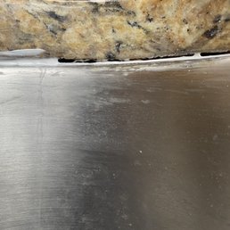 An example of a section of sink that wasn't fully caulked, after they came out to fix the caulking. An example of a section of sink that wasn't fully caulked, after they came out to fix the caulking.