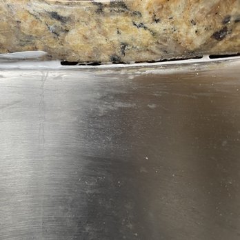 Vortex Plumbing - An example of a section of sink that wasn't fully caulked, after they came out to fix the caulking. - Plumbing Near Me Vortex Plumbing - An example of a section of sink that wasn't fully caulked, after they came out to fix the caulking. - Plumbing Near Me