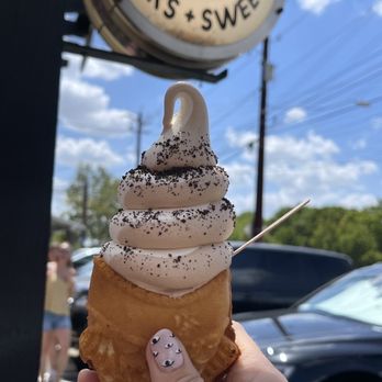 Omg Squee - Vietnamese Coffee and Cereal Milk soft-serve swirled and topped with Oreo dust on a taiyaki cone lined with Nutella. - Desserts Near Me - Austin, Texas