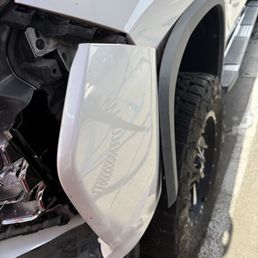 HIT THE CEMENT POLL AFTER COMING OUT THE CAR WASH.  TURNING RADIUS IS TOO SHORT