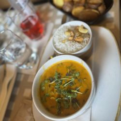 Lugeck - Cauliflower curry with cashew rice, rosemary potatoes, rice and Organic raspberry rhubarb soda.
