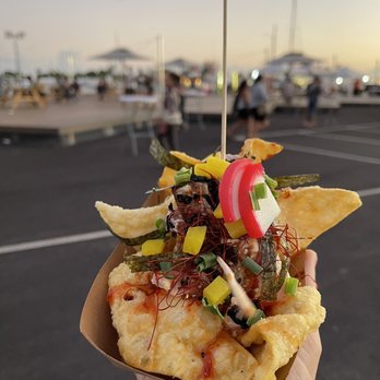 Ono Fresh Poke - a hand holding a nacho - Poke Near Me - Honolulu, Hawaii Ono Fresh Poke - a hand holding a nacho - Poke Near Me - Honolulu, Hawaii