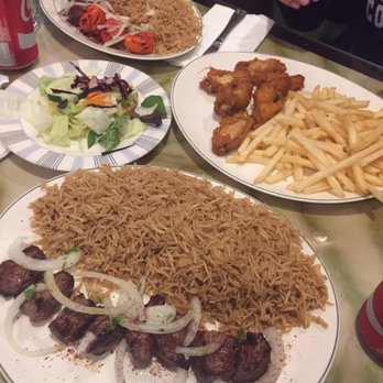 Choopan Grill - bottom: lamb with brown rice Top: mixed grill with brown rice, chicken wings with French fries. - Afghan Near Me - Hicksville, New York Choopan Grill - bottom: lamb with brown rice Top: mixed grill with brown rice, chicken wings with French fries. - Afghan Near Me - Hicksville, New York