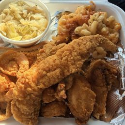 Fish, shrimp, chicken platter with cabbage and Mac & cheese Fish, shrimp, chicken platter with cabbage and Mac & cheese