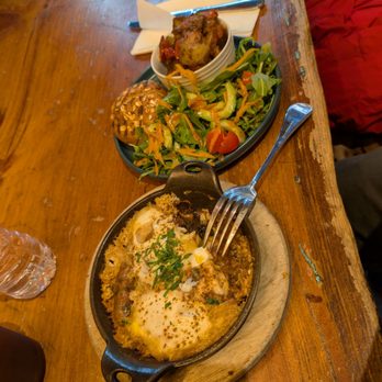 Pause Cafe - Shakshuka with Marquez, side of salad and fried potatoes with tomatoes. - Moroccan Near Me - New York, New York
