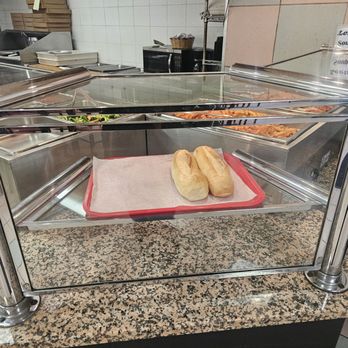 Pranzo Pizza & Pasta - a hot dog in a display case - Pizza Near Me - New York, New York