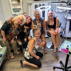 The Dark Heart Tattoo Shop - mothers and daughters getting matching tattoos, my granddaughter and our tattoo artist on the left....