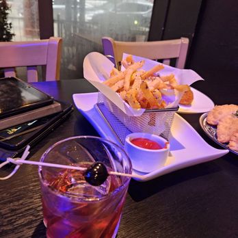 Mamajuana Cafe - This drink with the rum.... And the truffle fries - Latin American Near Me - Houston, Texas