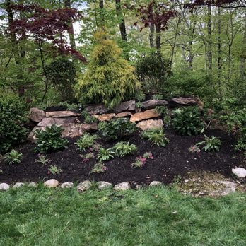 Young's Fencing - a rock wall in a garden - Landscaping Near Me - Ridgefield, Connecticut Young's Fencing - a rock wall in a garden - Landscaping Near Me - Ridgefield, Connecticut