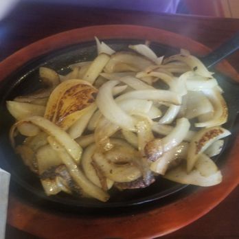 El Potro - I promise there's a yummy piece of steak under all those delicious onions! - Mexican Near Me - Winter Park, Florida