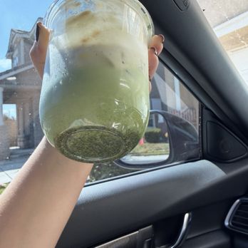 Stray Dogs Coffee Roasters - Banana matcha with a bunch of clumped matcha on the bottom - Coffee Roasteries Near Me - Riverside, California Stray Dogs Coffee Roasters - Banana matcha with a bunch of clumped matcha on the bottom - Coffee Roasteries Near Me - Riverside, California