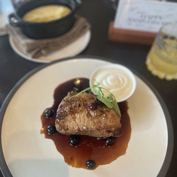 Acre Restaurants - Iowa hay roasted pork chop with pickled blueberries and black pepper jus with pommes puree - New American Near Me - Parkville, Missouri Acre Restaurants - Iowa hay roasted pork chop with pickled blueberries and black pepper jus with pommes puree - New American Near Me - Parkville, Missouri