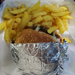 Burger combo with fries (this is after shook seasoned salt all over the fries) Burger combo with fries (this is after shook seasoned salt all over the fries)