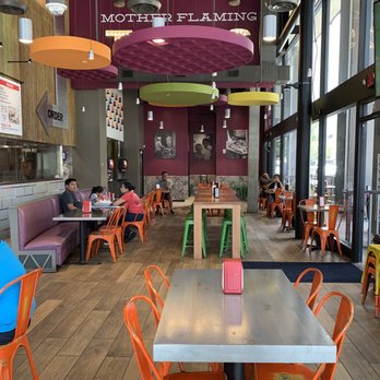 Twisted Trompo - Seating area. Not pictured is the bar seating to the left. - Mexican Near Me - Dallas, Texas Twisted Trompo - Seating area. Not pictured is the bar seating to the left. - Mexican Near Me - Dallas, Texas