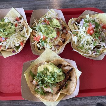 Oscars Mexican Seafood - Surf and Turf Taco (top left)  Taco Especial (top middle)  Battered Fish Taco ( top right)  Grilled fish taco (bottom middle) - Mexican Near Me - San Diego, California