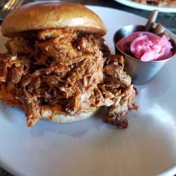 The Kosmos - Red chili pulled pork sandwich. - Bars Near Me - Albuquerque, New Mexico