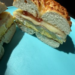 Coffee42go - A freshly toasted Asiago cheese bagel loaded with double eggs, double cheese, tender oven-roasted turkey, and fresh tomatoes.
