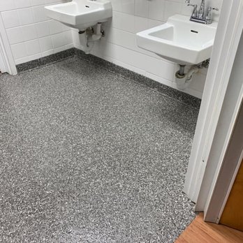 Integrity Concrete Coatings - a bathroom with two sinks and a toilet - Flooring Near Me Integrity Concrete Coatings - a bathroom with two sinks and a toilet - Flooring Near Me