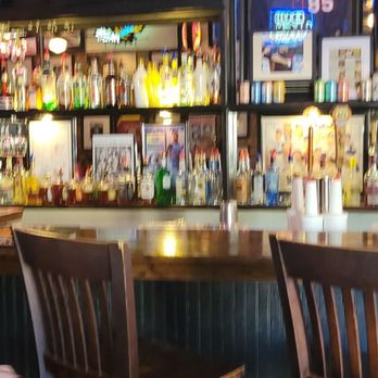 J O' Gradys - a bar with wooden chairs - Burgers Near Me - Sumter, South Carolina J O' Gradys - a bar with wooden chairs - Burgers Near Me - Sumter, South Carolina