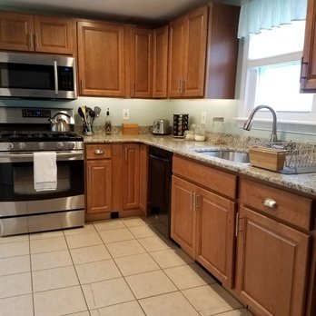 Spencer Granite Co. - kitchen with stainless steel appliances - General Contractors Near Me - HUDSON, New Hampshire