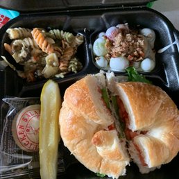 The classic carol on a croissant , pasta salad, & grape salad The classic carol on a croissant , pasta salad, & grape salad