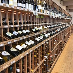 Town Wine & Spirits - A view down our wine room wall where our selections of domestic and french wines live!