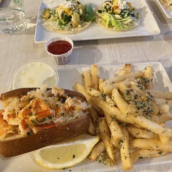 Market Seafood Eatery - Half hot Connecticut lobster roll with garlic fries and shrimp tacos - Seafood Near Me - Seattle, Washington