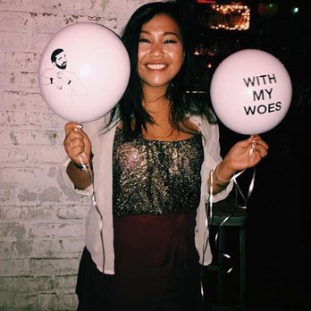 BarCulture - a woman holding two balloons that say with my woes - Bars Near Me - New Orleans, Louisiana BarCulture - a woman holding two balloons that say with my woes - Bars Near Me - New Orleans, Louisiana