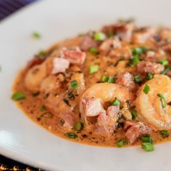 5 Under Golf Center - Mardi Gras Shrimp & Grits - pork belly, jumbo shrimp, and our spicy New Orleans butter and cream