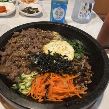 Minari - Hot pot bibimbap with over easy egg ... goguchan on the side and second bottle of Jinro soju. - Korean Near Me - San Bruno, California Minari - Hot pot bibimbap with over easy egg ... goguchan on the side and second bottle of Jinro soju. - Korean Near Me - San Bruno, California