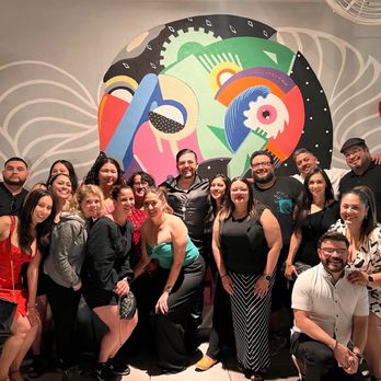 Diablo Rooftop - The group in front of one of the muraled walls - Lounges Near Me - Phoenix, Arizona