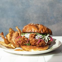 Dish Society - Hot Chicken Sandwich pretzel bun fried chicken cabbage slaw pickled onions dill ranch lunch dinner brunch