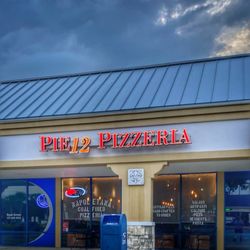 Pie12 Napoletana Coal Fired Pizzeria - Outside signage, facade and entrance from parking lot