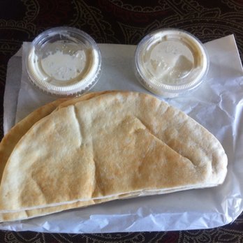 Chicken Maison - Garlic Sauce and Pita Breads which we did not receive during our stay, so they offered them to us as To-Go. - Mediterranean Near Me - Gardena, California Chicken Maison - Garlic Sauce and Pita Breads which we did not receive during our stay, so they offered them to us as To-Go. - Mediterranean Near Me - Gardena, California