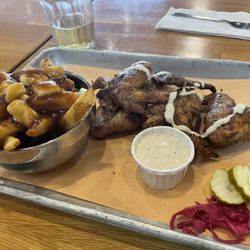 Patina Brewing - Happy hour poutine and wings with white sauce