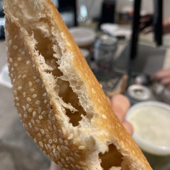 Photo of NG Cafe - Austin, TX, United States. Nom nom nom fresh bread and this sesame hollow one is vegan