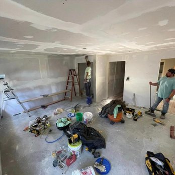 Southern Charm Remodeling - a man working in a room - Roofing Near Me Southern Charm Remodeling - a man working in a room - Roofing Near Me