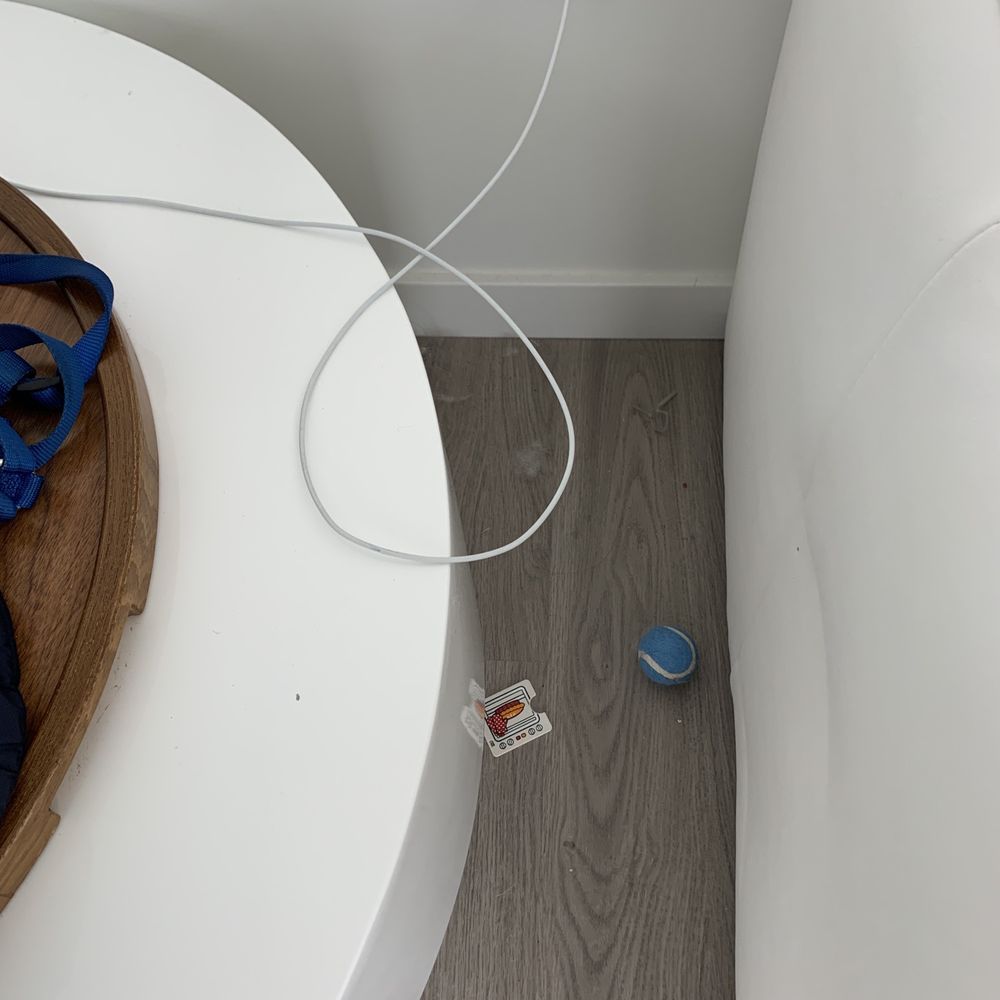 Didn't clean between side table and sofa.
