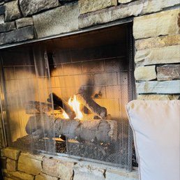 Fireplace lounge area in their patio bar Fireplace lounge area in their patio bar